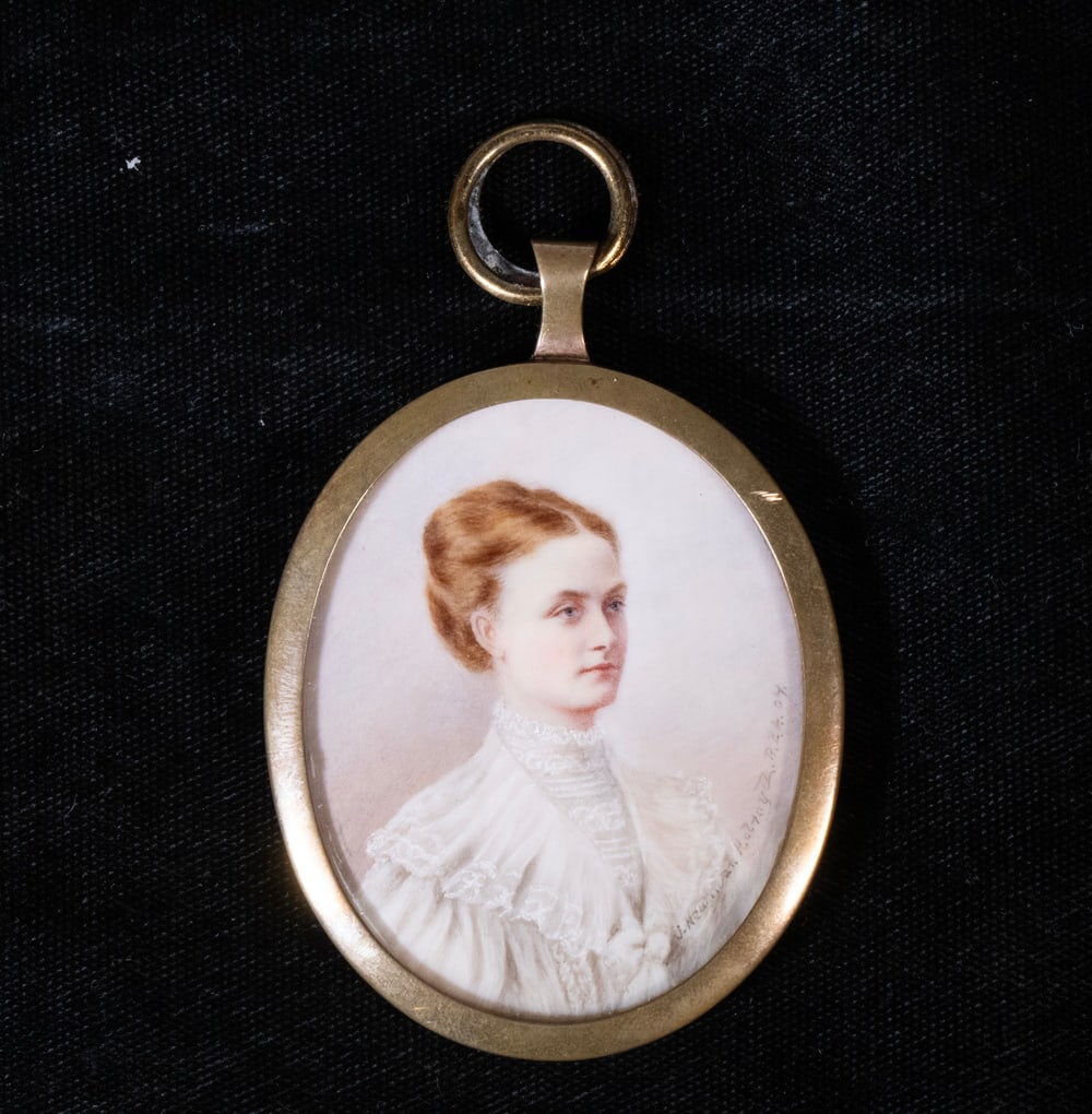 J. NEWMAN HOLROYD MINIATURE PORTRAIT OF WOMAN: J. NEWMAN HOLROYD MINIATURE PORTRAIT OF WOMAN Oval Portrait of Young Red-haired Woman in white Edwardian summer dress, signed and dated 1907, in brass rim frame with loop, convex front lens, concave