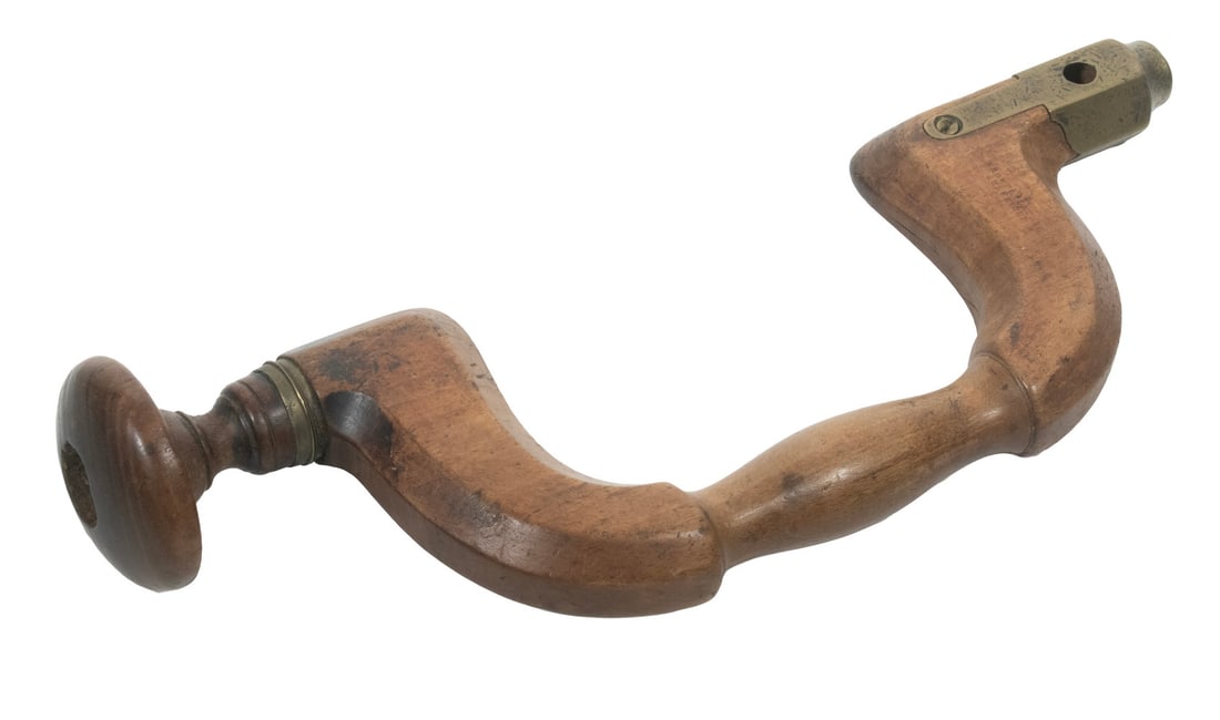 BROWN & FLATHER, SHEFFIELD WOODEN BIT BRACE: BROWN & FLATHER, SHEFFIELD WOODEN BIT BRACE Mid-19th c. Brass-Mounted Turned Wooden Hand Tool, stamped "Brown & Flather, Sheffield." Length: 14 in. (35.6 cm.)