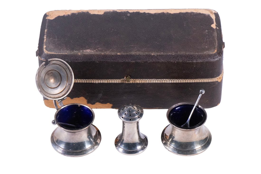 CASED ENGLISH STERLING CONDIMENT SET: CASED ENGLISH STERLING CONDIMENT SET George V Period (3)-Piece Silver Serving Set, by James Dixon & Sons, Birmingham, 1934, the mustard and salt servers with cobalt glass liners; plus two small spoons