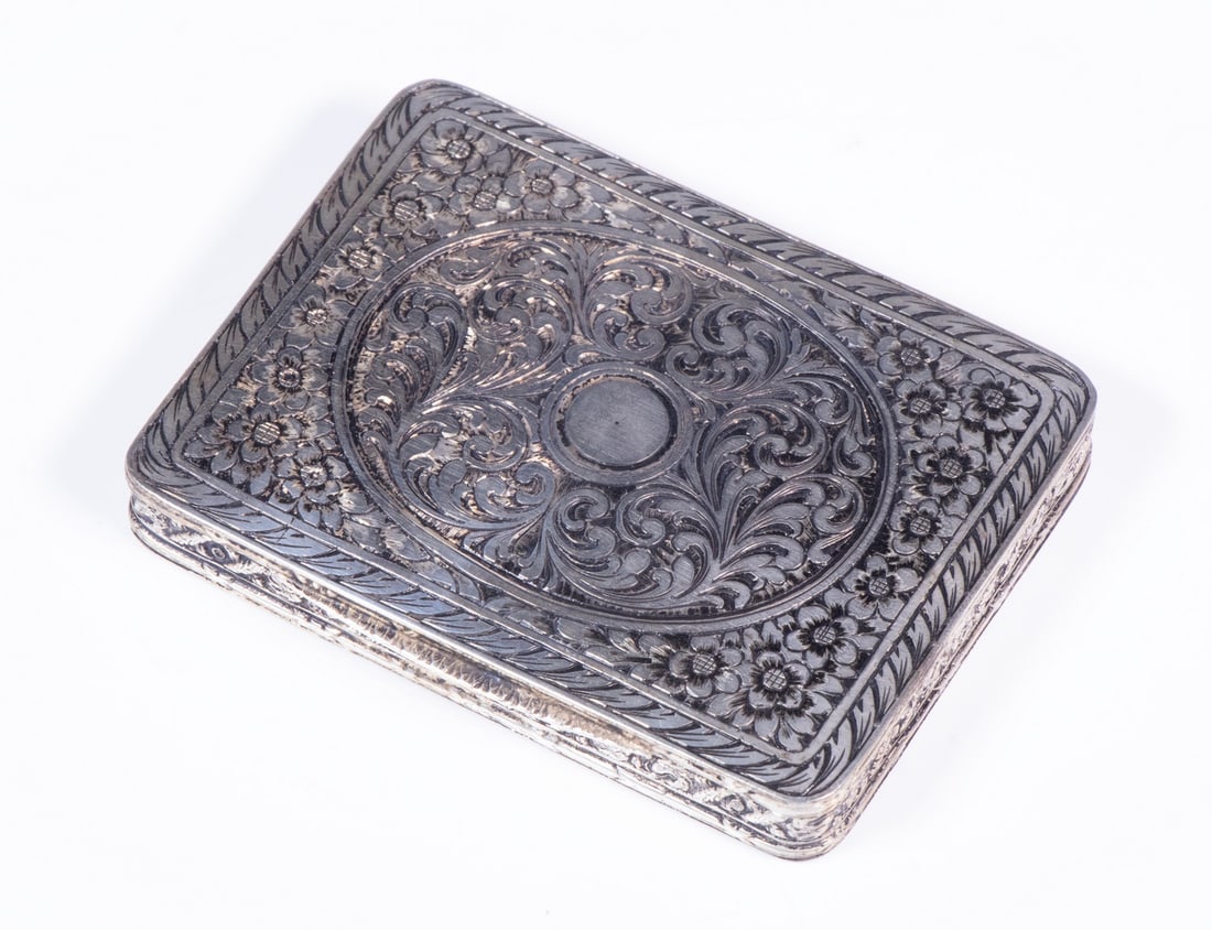 CONTINENTAL 800-SILVER PASTILLE BOX: CONTINENTAL 800-SILVER PASTILLE BOX Hinged Lid Silver Case, probably Italian, with fancy engraved scrolled and floral decoration. 2.29 ozt. 3 x 2 1/2 in. (7.6 x 6.4 cm.)