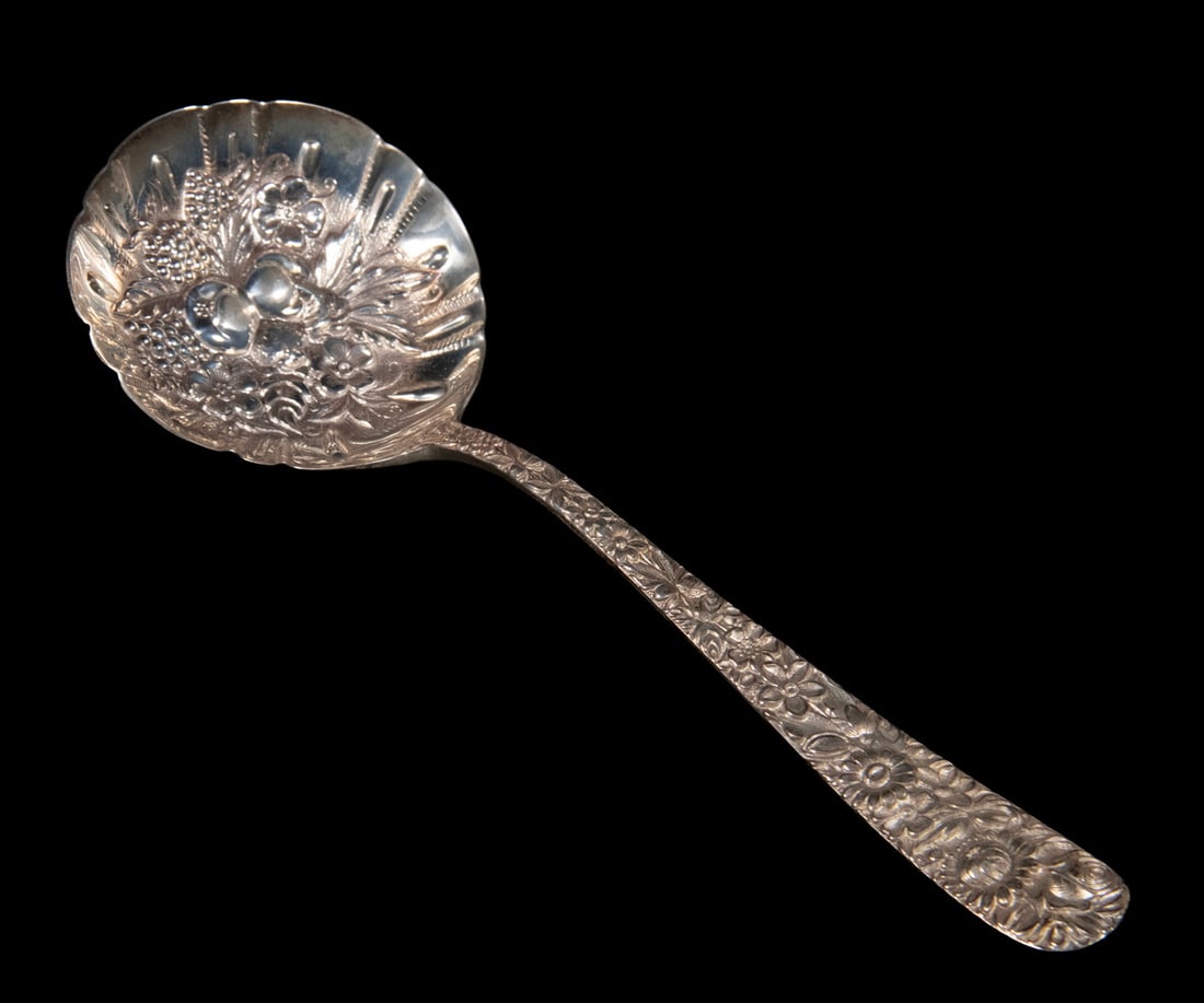 KIRK STIEFF "REPOUSSE" STERLING SERVING SPOON: KIRK STIEFF "REPOUSSE" STERLING SERVING SPOON Hand Chased Sterling Silver Berry Spoon, with fancy repousse decorated bowl. 2.29 ozt. Length: 7 1/2 in. (19.1 cm.)