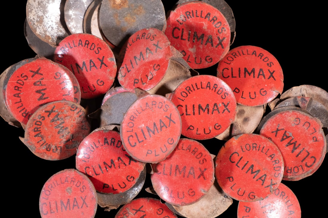 (51) ANTIQUE TOBACCO TIN TAGS LORILLARD S CLIMAX PLUG: (51) ANTIQUE TOBACCO TIN TAGS LORILLARD S CLIMAX PLUG A group of 51 circular lithographed tin tags in red enamel, printed in black with Lorillard s Climax Plug. Issued by P. Lorillard Co., one of the