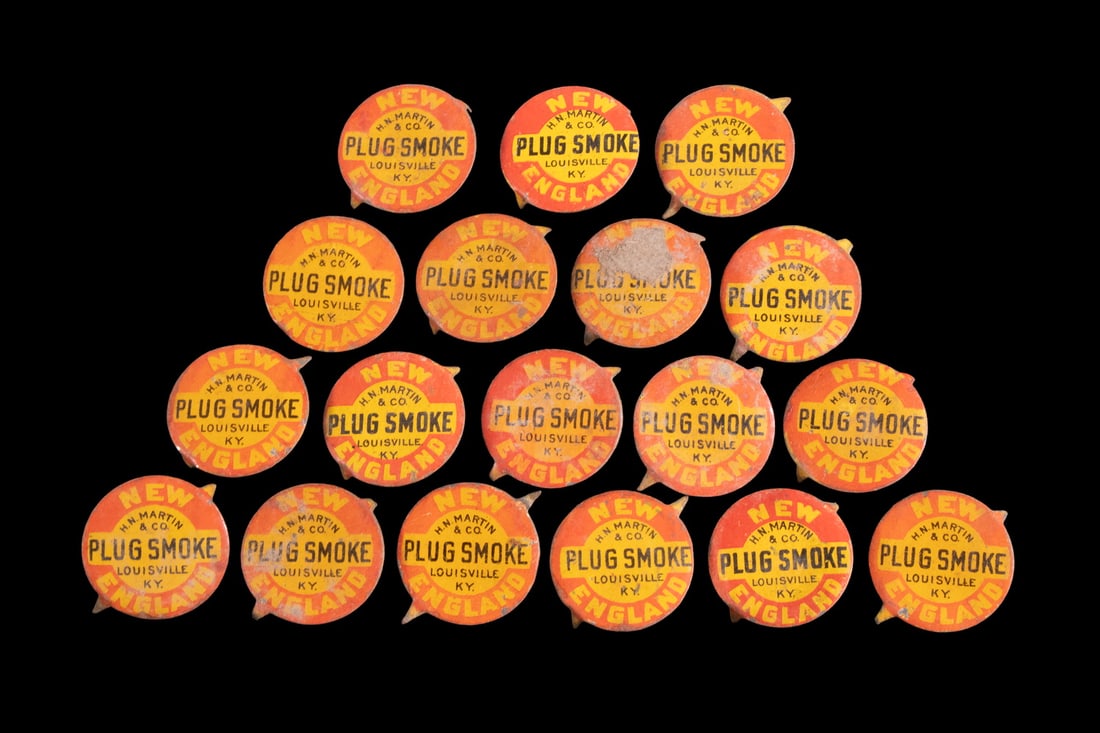 (18) ANTIQUE NEW ENGLAND "PLUG SMOKE" TOBACCO TIN TAGS: (18) ANTIQUE NEW ENGLAND "PLUG SMOKE" TOBACCO TIN TAGS A group of 18 circular tin tobacco tags printed in bright red, yellow, and black, advertising New England Plug Smoke, manufactured by H.N.