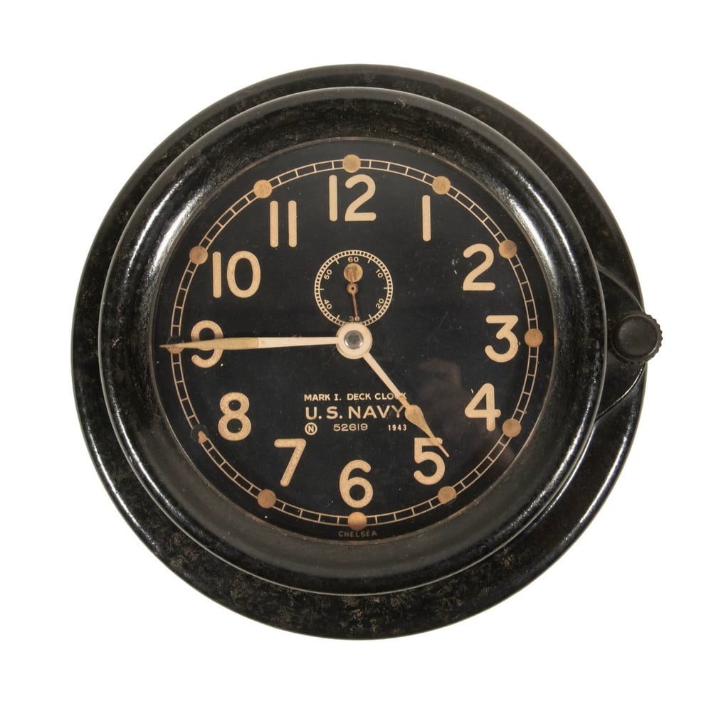 WWII ERA US NAVY MARK I DECK CLOCK: WWII ERA US NAVY MARK I DECK CLOCK Bakelite Cased 1943 Navy Deck Clock, with hinged case, serial number N 52619, Arabic numerals, 8-day movement. Includes key. Size: 8 1/2 x 4 1/2 in. (21.6 x 11.4 cm.