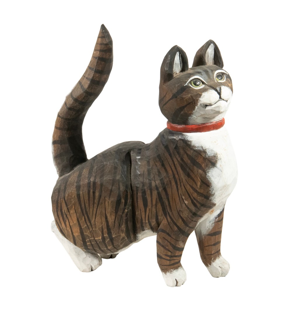 MAINE ARTIST CARVED FULL SIZE CAT SCULPTURE: MAINE ARTIST CARVED FULL SIZE CAT SCULPTURE Crouching Tabby Cat, with red collar, in carved and painted wood, the underside illegibly signed and dated 1992. Size: 14 x 5 x 11 1/2 in. (35.6 x 12.7 x