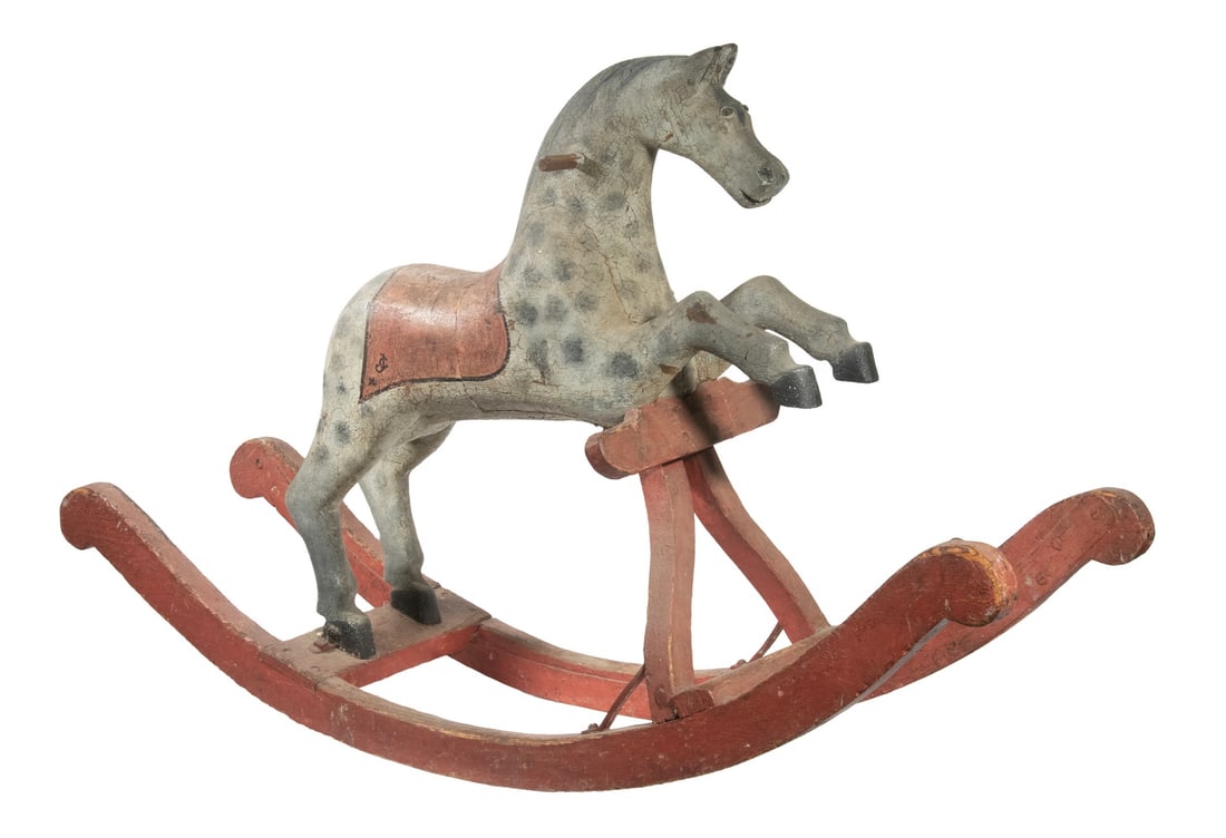 19TH C. FOLK ART ROCKING HORSE: 19TH C. FOLK ART ROCKING HORSE Naive Painted Hardwood Dappled Gray Rocking Horse with red runners and saddle cloth. Runner chipped, lacks tail. Approx. 31 x 48 x 15 in. (78.7 x 121.9 x 38.1 cm.)