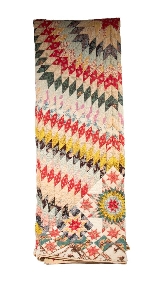 CIRCA 1900 COTTON CHINTZ SUMMER QUILT: CIRCA 1900 COTTON CHINTZ SUMMER QUILT Eye Dazzler Sunburst and Stars, partly hand stitched, comprised of very strong colors, still bright and fresh, white backing, bound edge. Size: 86 x 91 in.