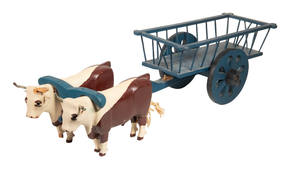 FOLK ART TOY OX CART: FOLK ART TOY OX CART Vintage Hand Crafted Cart with Two Oxen, in painted wood, with yoke and working wheels. Missing one yoke bow, chip to head/horn of one ox. Size: 6 x 5 1/2 x 22 in. (15.2 x 14 x
