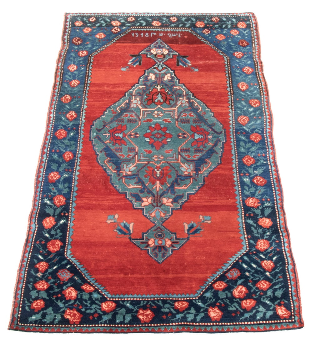 KARABAGH RUG (4'5" X 7'2"): KARABAGH RUG (4'5" X 7'2") Signed and dated 1918, South Caucasus. Features a notched slate diamond medallion with midnight blue, sky blue, gold, and red on the abrashed red field with a midnight blue