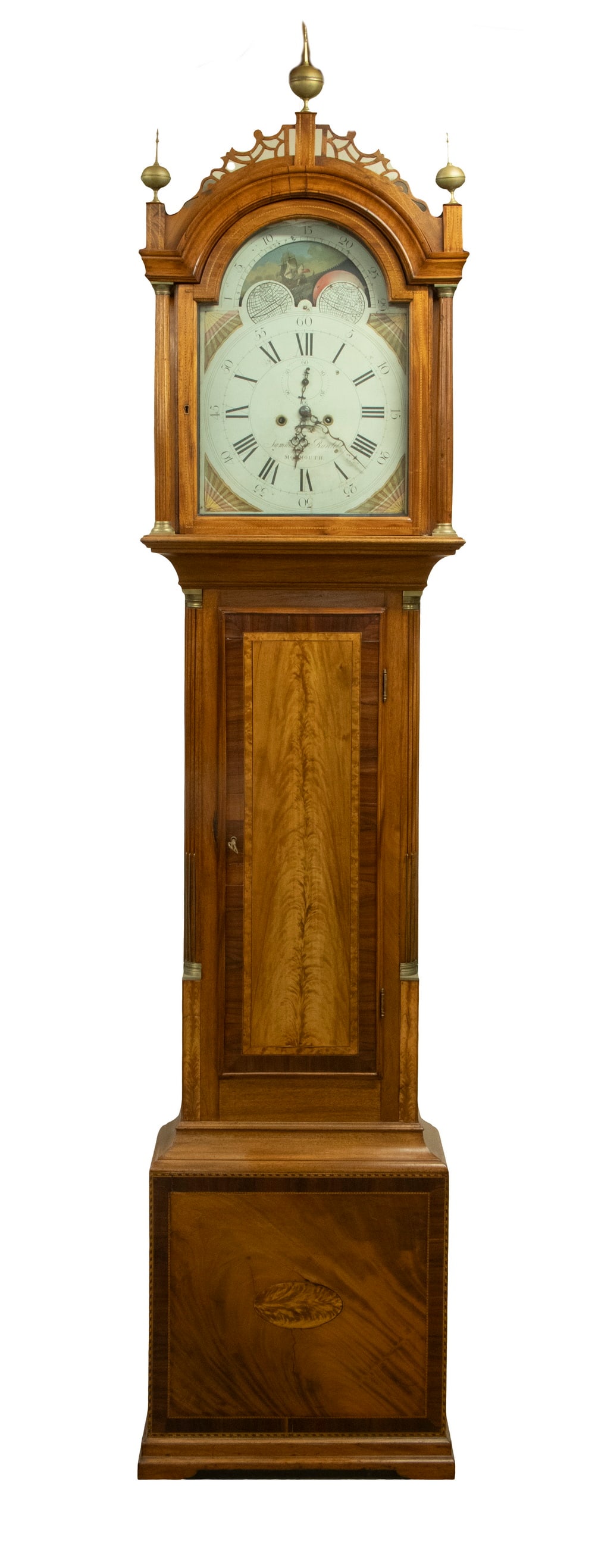 TALL CLOCK BY SAMUEL RANLET (1780-1860) OF MONMOUTH, MAINE: TALL CLOCK BY SAMUEL RANLET (1780-1860) OF MONMOUTH, MAINE A breathtaking piece, in a finest-quality signed mahogany case. Chippendale, with striking crotch mahogany door panel, having filigree bonnet