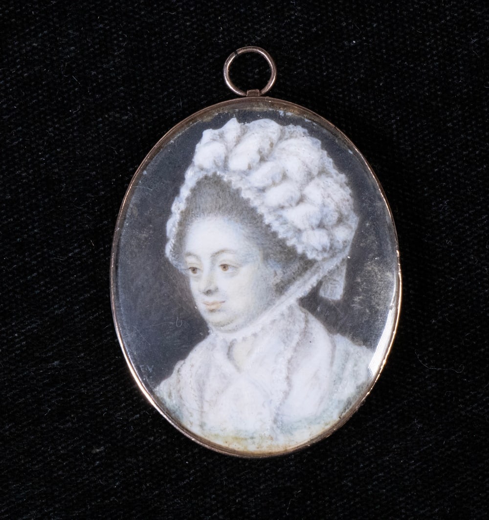 MINIATURE PORTRAIT OF A WOMAN, FRENCH, CIRCA 1780: Y MINIATURE PORTRAIT OF A WOMAN, FRENCH, CIRCA 1780 Oval Portrait of an Older Woman, looking left, wearing an ornate, decorated bonnet, oil on ivory, in 10K gold broach with domed lens, retaining
