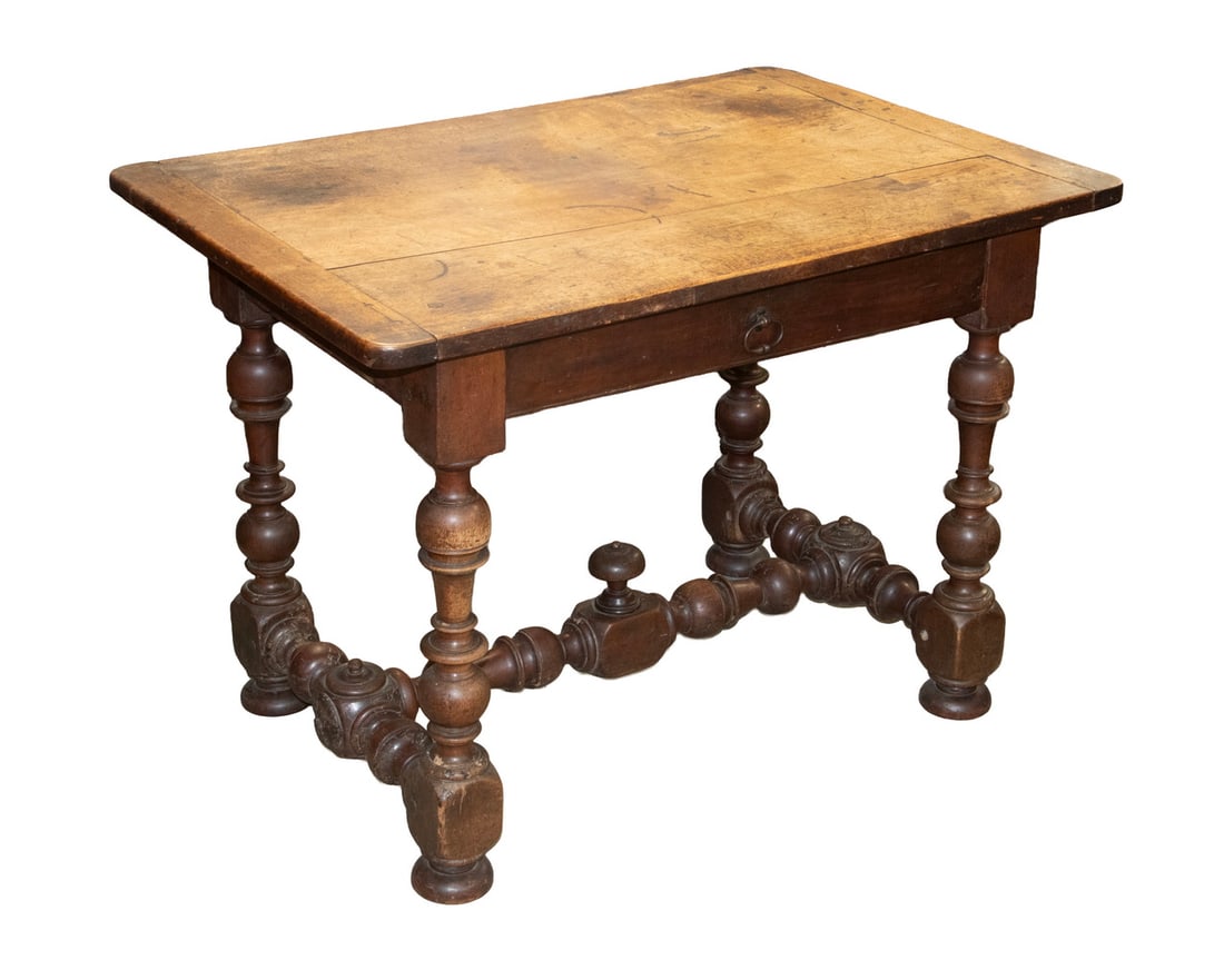 17TH C. WALNUT WRITING TABLE: 17TH C. WALNUT WRITING TABLE Walnut Writing Desk, having a pegged top with breadboard ends, single drawer with iron oval drop bail pull, set on ornately turned legs and turned central stretcher with c
