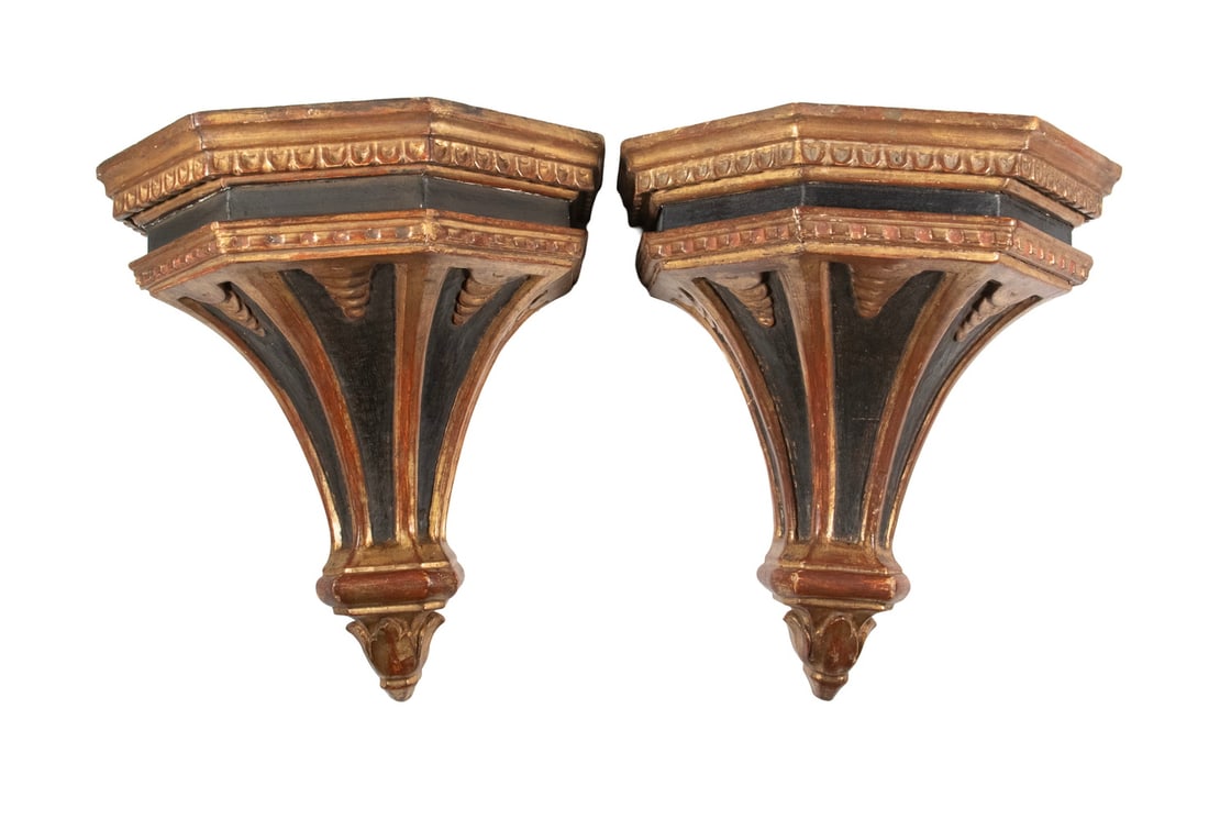 PAIR OF EARLY 20TH C. FRENCH EMPIRE STYLE BLACK & GOLD BRACKETS: PAIR OF EARLY 20TH C. FRENCH EMPIRE STYLE BLACK & GOLD BRACKETS Carved Giltwood Wall Brackets, five-sided, with concave tapered black panels on face. Size: 12 x 7 1/2 x 11 in. (30.5 x 19.1 x 27.9 cm.)