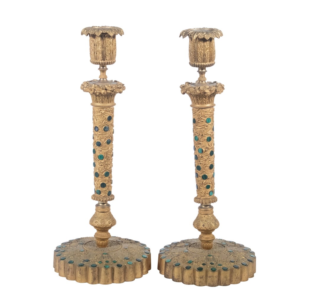 PAIR OF RUSSIAN GILT BRONZE & MALACHITE CANDLESTICKS: PAIR OF RUSSIAN GILT BRONZE & MALACHITE CANDLESTICKS 20th c. Gilt Cast Bronze with malachite inlaid jewels, lobed edge, raised decoration of Greek harps, vases of flowers linked by blossom swags,