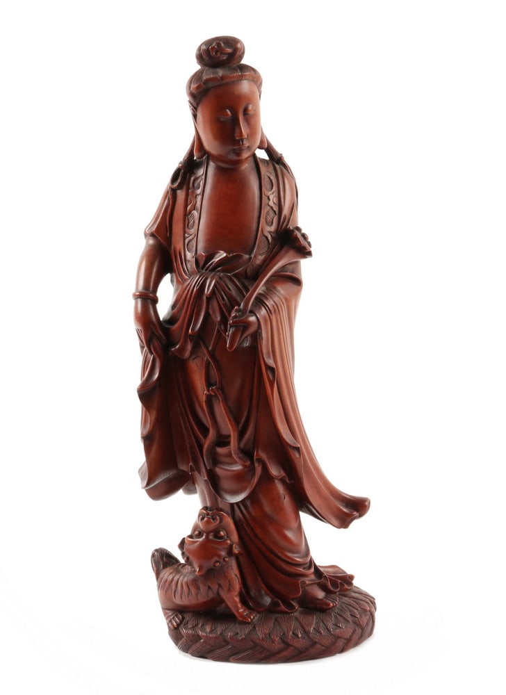 CHINESE QING BOXWOOD GUANYIN FIGURE: CHINESE QING BOXWOOD GUANYIN FIGURE A Delicate Boxwood Carving of Guanyin, first half of the Qing Dynasty, possibly during the reign of the Kangxi Emperor (1662-1722), elegantly coiffed and dressed