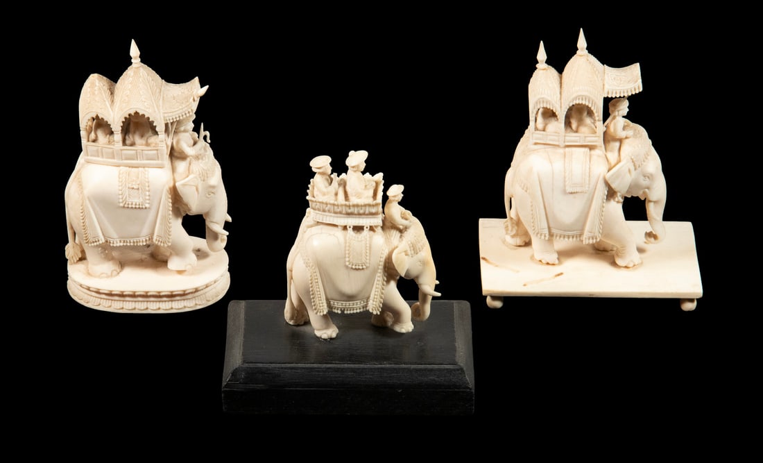 (3) 19TH C. ANGLO-INDIAN CARVED IVORY ELEPHANTS WITH HOWDAHS: Y (3) 19TH C. ANGLO-INDIAN CARVED IVORY ELEPHANTS WITH HOWDAHS Well Carved Mughal Aristocracy in Transit, two beasts bearing a load of three under ornate Howdahs, the third and smallest uncovered, on 