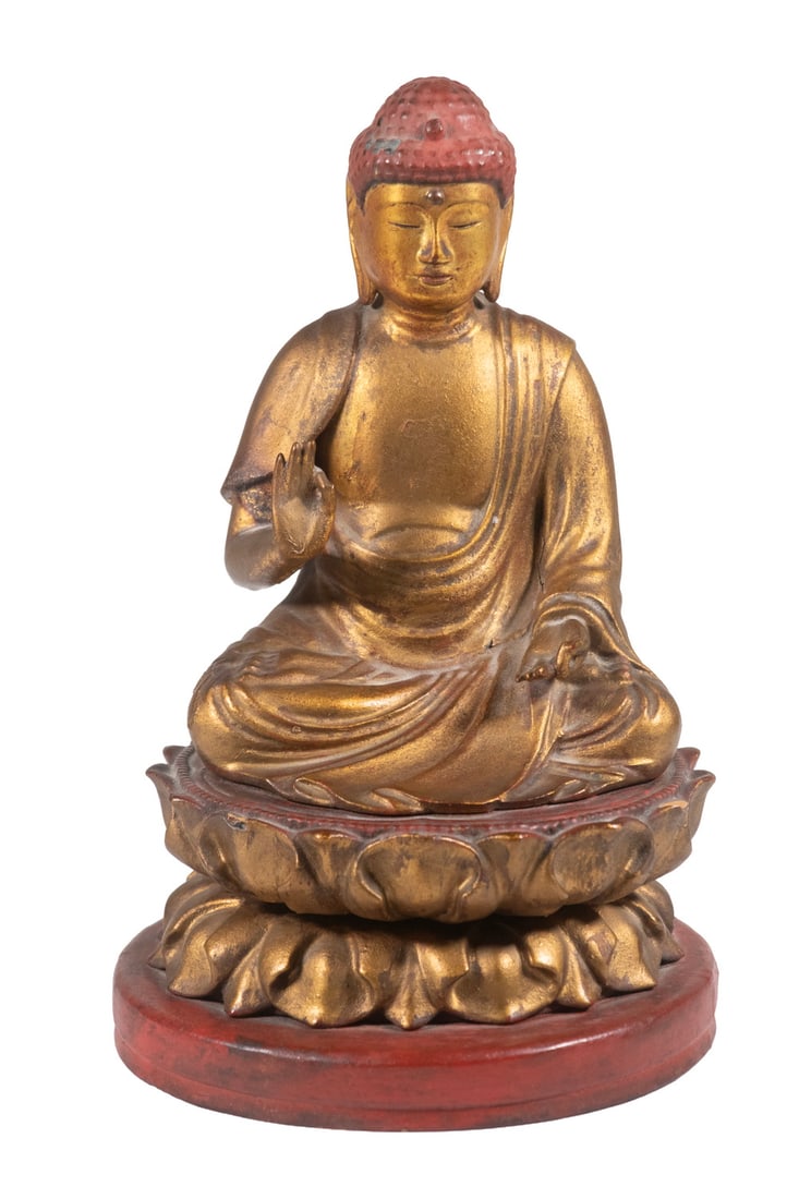 JAPANESE LACQUERED WOOD BUDDHA FIGURE: JAPANESE LACQUERED WOOD BUDDHA FIGURE A seated Buddha figure carved in wood and finished with gilt and red lacquer, shown in a traditional meditative pose upon a lotus-form base. The figure displays s