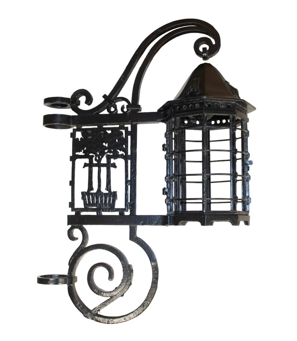 CIRCA 1914 FOREST HILLS QUEENS, NY IRON STREETLIGHT FIXTURE: CIRCA 1914 FOREST HILLS QUEENS, NY IRON STREETLIGHT FIXTURE Early 20th c. Wrought Iron Tudor Revival Style Light Fixture, with seven glass insert panels, originally perched atop a lamppost in Station