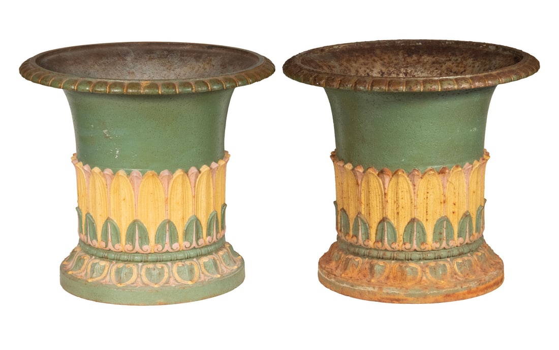 PAIR OF EGYPTIAN REVIVAL CAST IRON GARDEN URNS: PAIR OF EGYPTIAN REVIVAL CAST IRON GARDEN URNS 19th c. Heavy Cast Iron Urns in form of Late Dynasty Egyptian Column Capitols, in green and ochre paint, decorated with lappets of palm leaves. Some corr