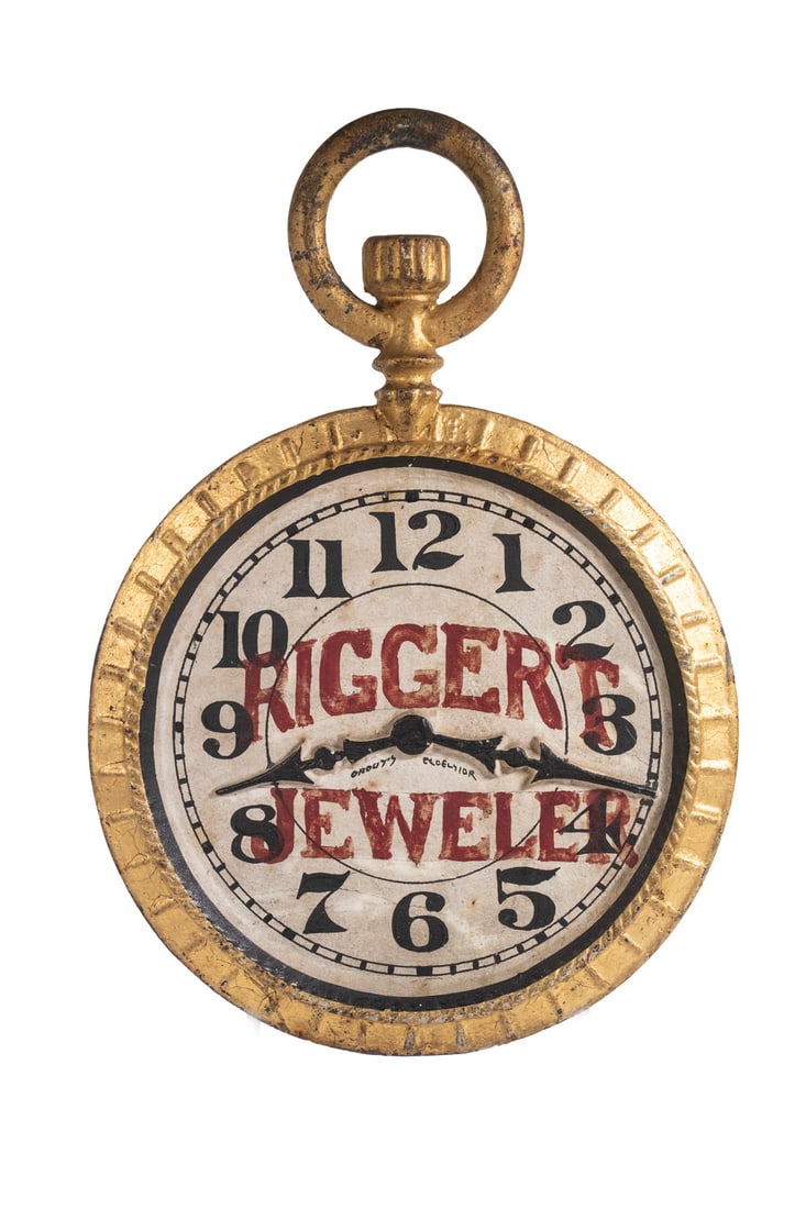 RARE 19TH C. CAST IRON JEWELERS TRADE SIGN: RARE 19TH C. CAST IRON JEWELERS TRADE SIGN Two-Sided Pocket Watch Form Sign painted in red lettering on black and white dial "Riggert Jeweler", having a gilt body and integral suspension ring. Size: