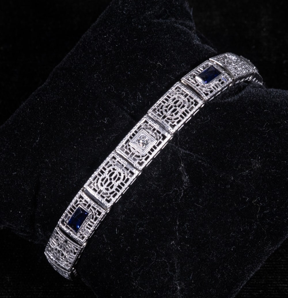 EDWARDIAN 14K GOLD SAPPHIRES AND DIAMONDS FILIGREE BRACELET: EDWARDIAN 14K GOLD SAPPHIRES AND DIAMONDS FILIGREE BRACELET A 14K white gold filigree bracelet, composed of openwork rectangular links set with (3) faceted blue sapphires and (2) small round diamonds.