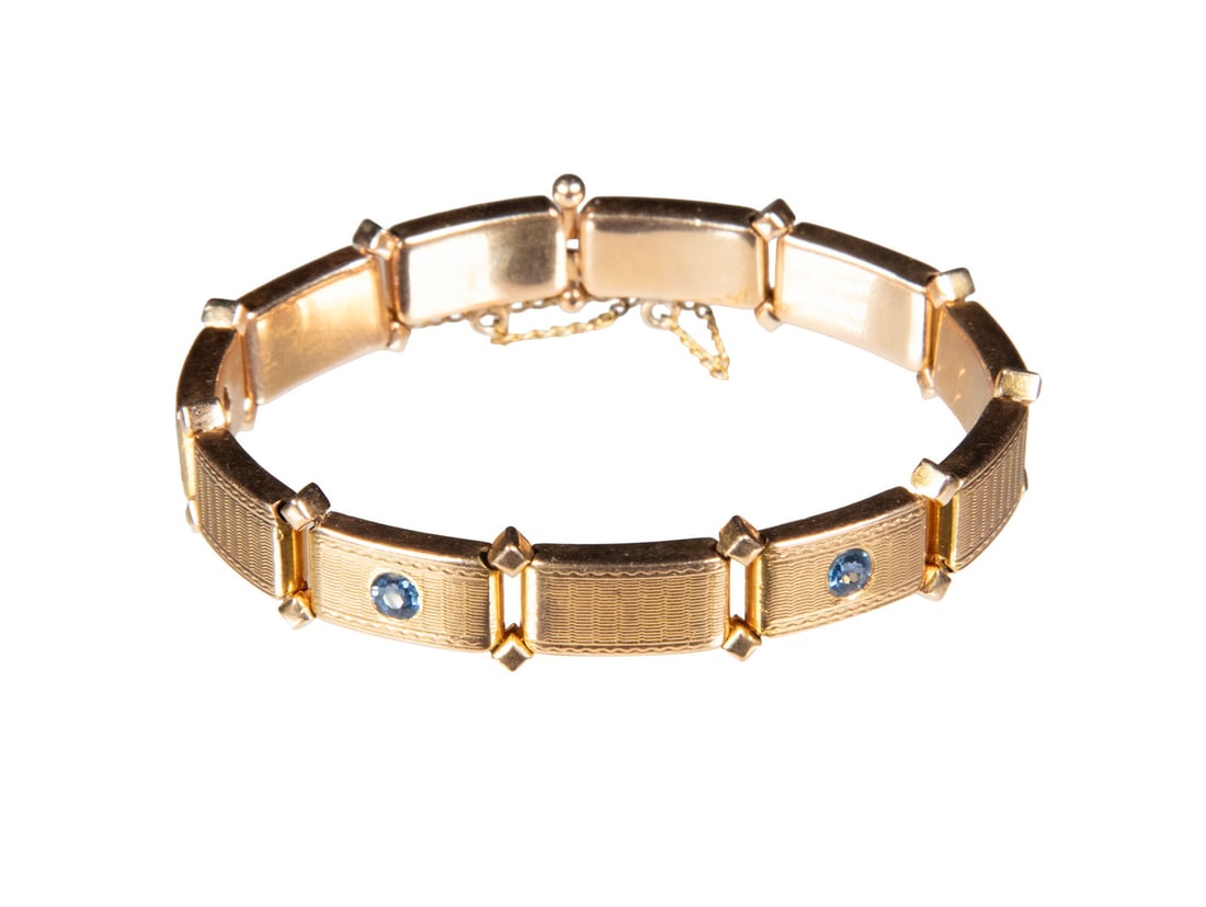 VINTAGE 14K GOLD AND SAPPHIRE LINK BRACELET: VINTAGE 14K GOLD AND SAPPHIRE LINK BRACELET A 14K gold bracelet composed of textured rectangular links, set with (3) round sapphires measuring approximately 3.26 mm each. Completed with a box clasp an
