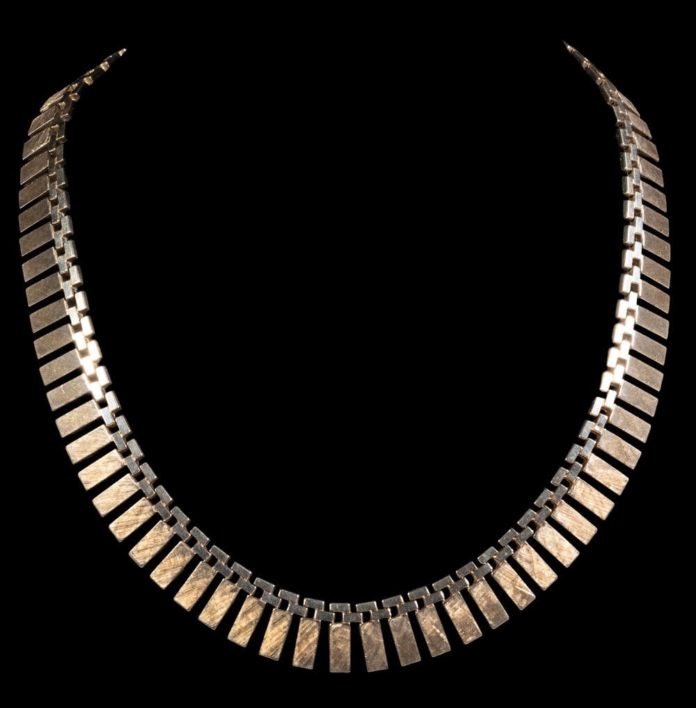 VINTAGE 14K GOLD GEOMETRIC LINK NECKLACE: VINTAGE 14K GOLD GEOMETRIC LINK NECKLACE A vintage 14K yellow gold necklace featuring articulated rectangular links with a softly textured finish, forming a bold geometric design. Completed with an in