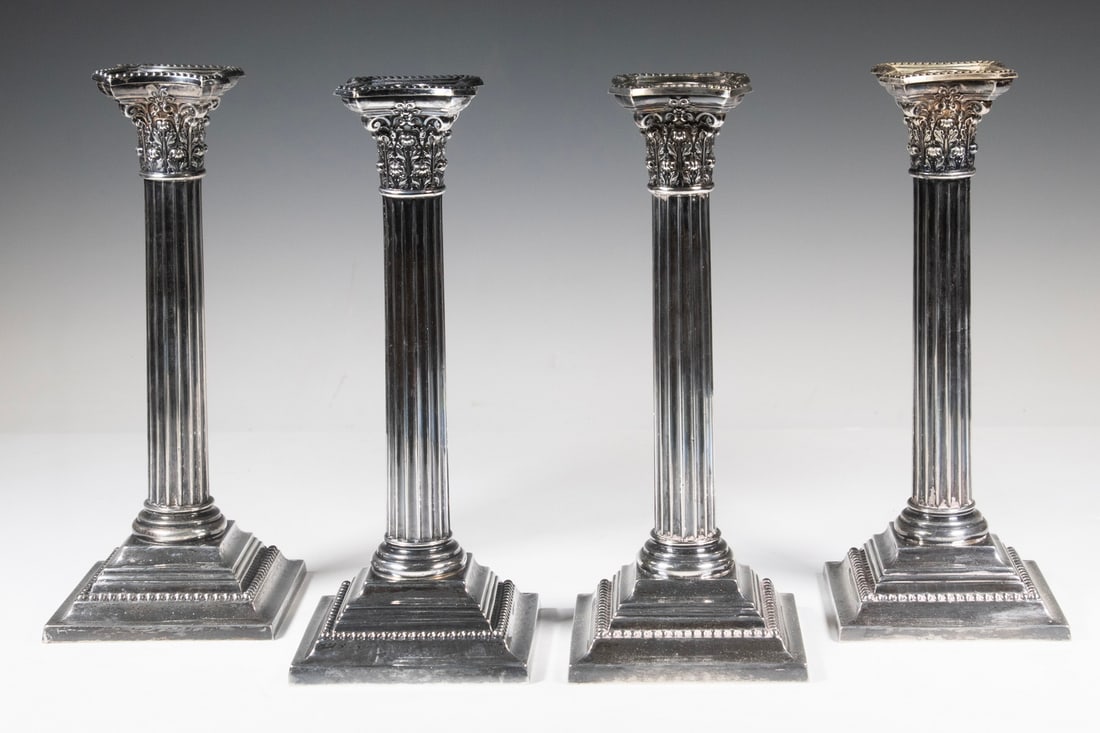 (4) GORHAM STERLING SILVER CORINTHIAN COLUMN CANDLESTICKS: (4) GORHAM STERLING SILVER CORINTHIAN COLUMN CANDLESTICKS A set of four Gorham weighted sterling silver candlesticks in the Corinthian column form with fluted shafts and stepped square bases with