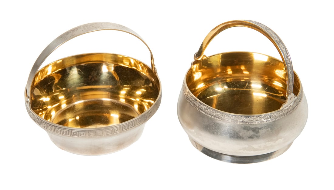 (2) RUSSIAN SILVER SUGAR BOWLS: (2) RUSSIAN SILVER SUGAR BOWLS Lot of (2) Soviet Era 916-Silver Basket Form Bowls, with swing handles and gilt washed interiors, incl: One with Greek key border, 1 1/2" high (4" to top of handle), 4 1