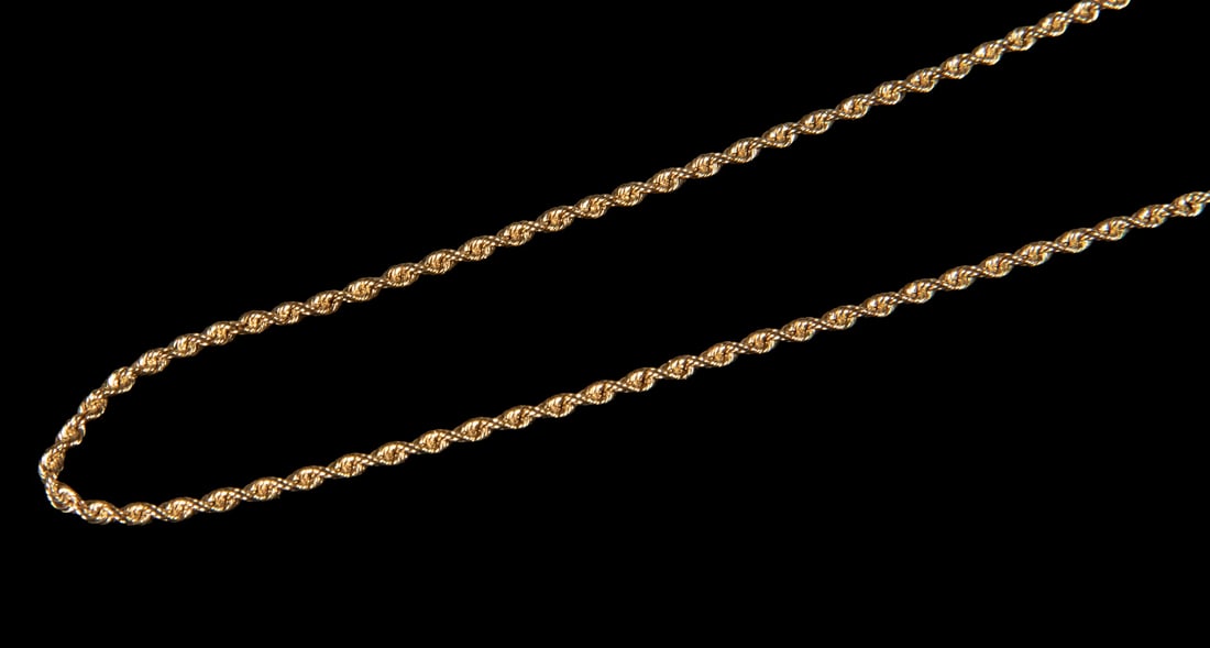 14K GOLD ROPE LINK NECKLACE: 14K GOLD ROPE LINK NECKLACE A 14K gold rope link necklace composed of tightly twisted links, terminating in a barrel clasp with safety catch, stamped. Classic and durable construction. 6.8 dwt. tw. Ov