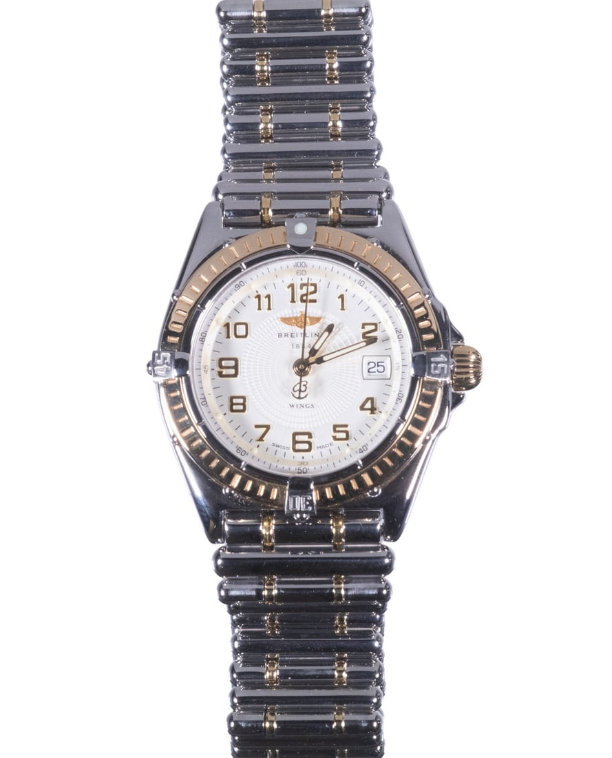 BREITLING WINGS LADY TWO TONE WRISTWATCH: BREITLING WINGS LADY TWO TONE WRISTWATCH 1990s Breitling "Wings Lady Cockpit" Time and Date Wristwatch, Ref# D67050. Round 30mm stainless steel case with 18k gold unidirectional bezel, and crown mount
