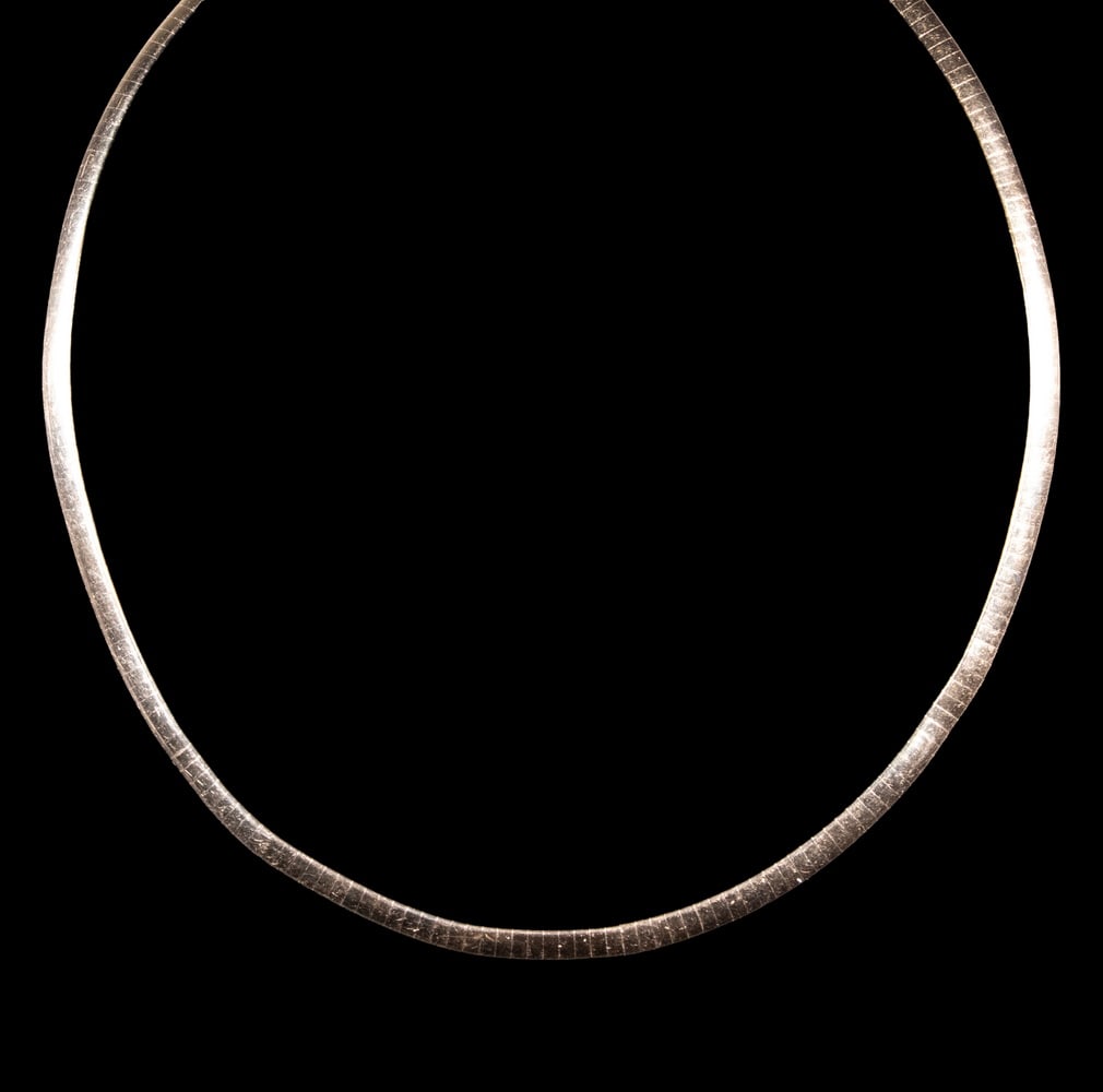 AURAFIN 14K TWO-TONE GOLD SEGMENTED NECKLACE: AURAFIN 14K TWO-TONE GOLD SEGMENTED NECKLACE A flexible segmented collar necklace in 14K gold, designed with a reversible two-tone finish, one side in yellow gold and the other in white gold. Marked