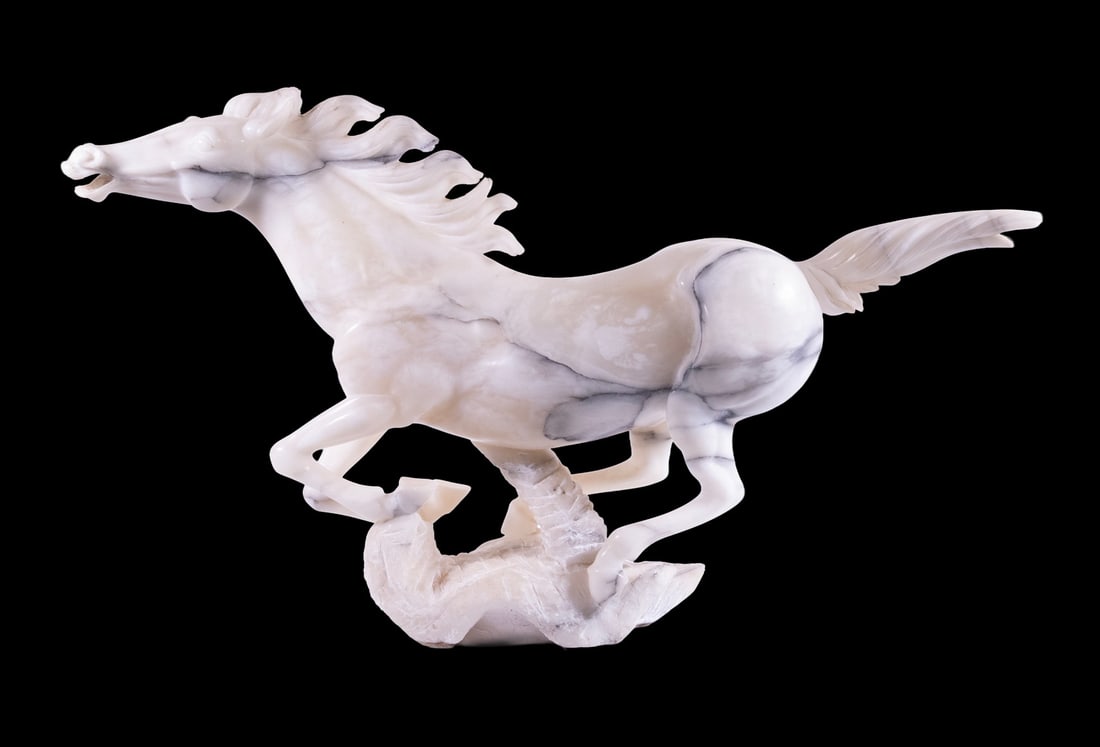 MID-20TH C. ITALIAN CARVED ALABASTER HORSE: MID-20TH C. ITALIAN CARVED ALABASTER HORSE Galloping Stallion, made by Professor Bessi Manufactory of Folterra. Purchased at CPA (Commercio Prodotti Artistici) of Venice. Size: 15 x 26 x 5 1/2 in.