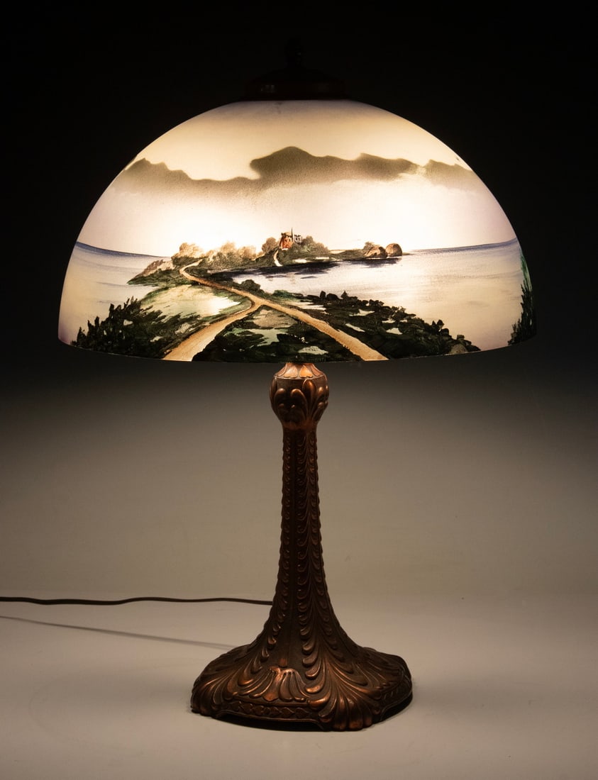REVERSE PAINTED GLASS SHADE TABLE LAMP: REVERSE PAINTED GLASS SHADE TABLE LAMP Vintage Lamp, with dome form hand painted glass shade depicting a continuous waterside scene, on an Art Nouveau style copper clad molded metal base, two-socket