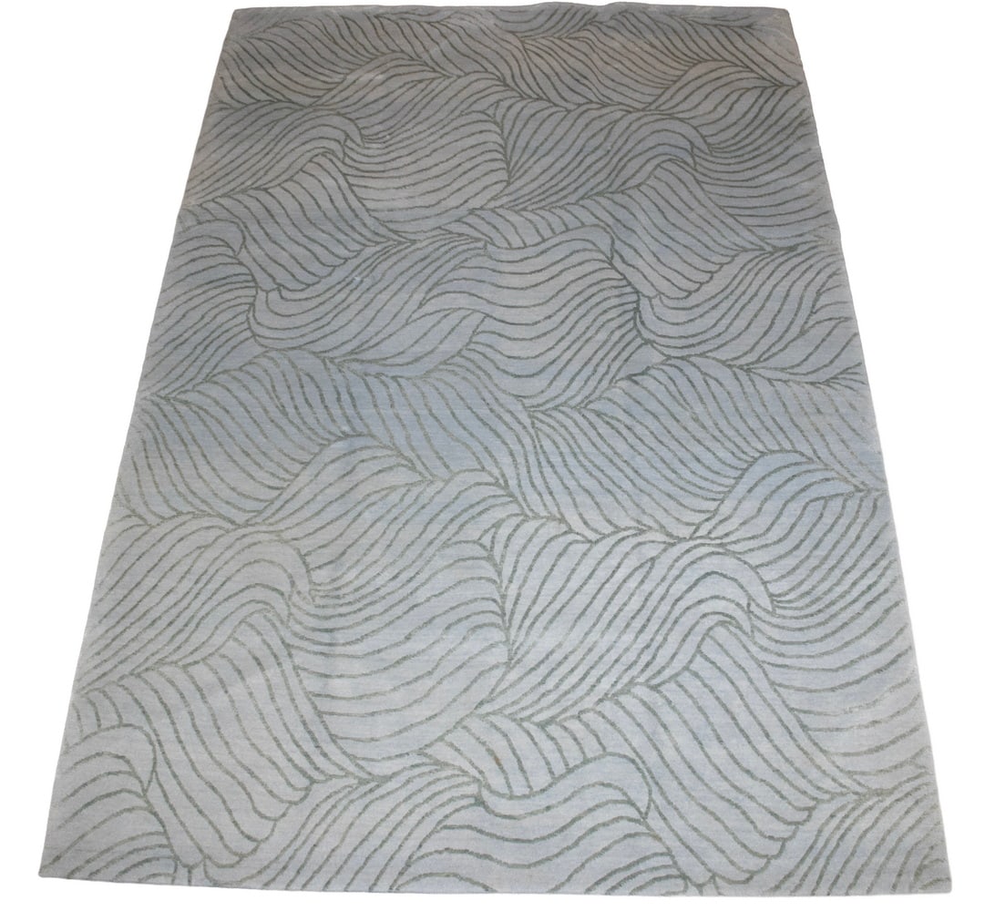 NEPALESE WOOL & SILK CARPET (6' X 8'10"): NEPALESE WOOL & SILK CARPET (6' X 8'10") Features plant and leaf motifs in gray and ivory set on a borderless sky blue field. Overall good condition OS: 72 x 106 in. (182.9 x 269.2 cm.)
