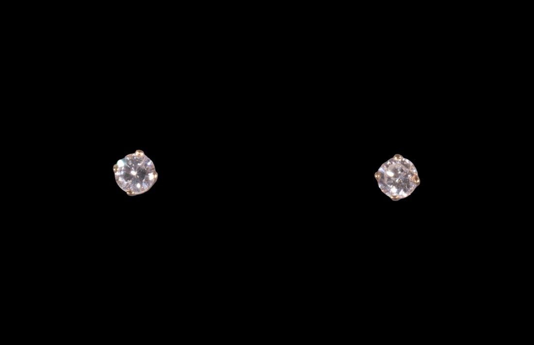 PR 14K GOLD AND DIAMOND STUD EARRINGS: PR 14K GOLD AND DIAMOND STUD EARRINGS Pair of 14K gold stud earrings, each set with one round brilliant-cut diamond in a four-prong setting. The diamonds measure approximately 3.42 mm in diameter and 