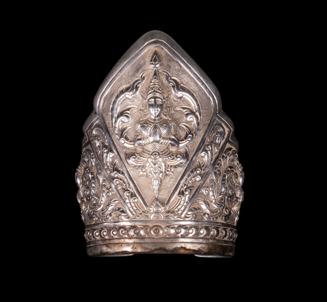 SIAM STERLING CUFF BRACELET: SIAM STERLING CUFF BRACELET Vintage Thai Silver Bracelet, with chased decoration of the Buddhist angel protector Theppanom, the interior stamped "Siam Sterling." Width: 3 1/2 in. (8.9 cm.), Interior: 