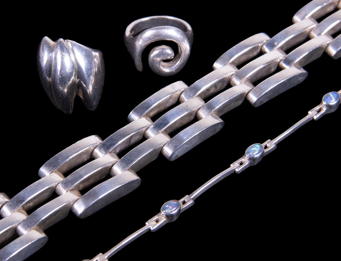 (4) VINTAGE STERLING SILVER JEWELRY PIECES: (4) VINTAGE STERLING SILVER JEWELRY PIECES A group of four sterling silver jewelry pieces, including a wide geometric link bracelet, a delicate bracelet set with (5) oval opal cabochons (likely synthe