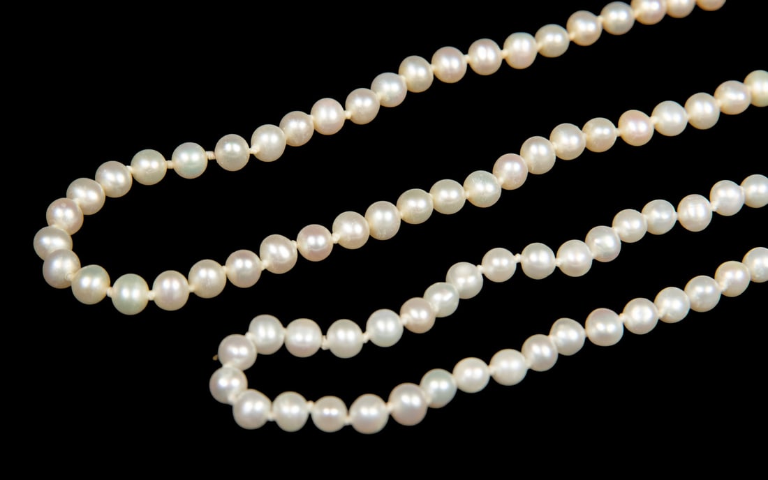 (2) STRANDS OF PEARL NECKLACES: (2) STRANDS OF PEARL NECKLACES Comprising two strands of cultured pearls, each composed of near-round pearls measuring approximately 4.5?5.0 mm, strung with 14K gold clasps, stamped. The pearls displa