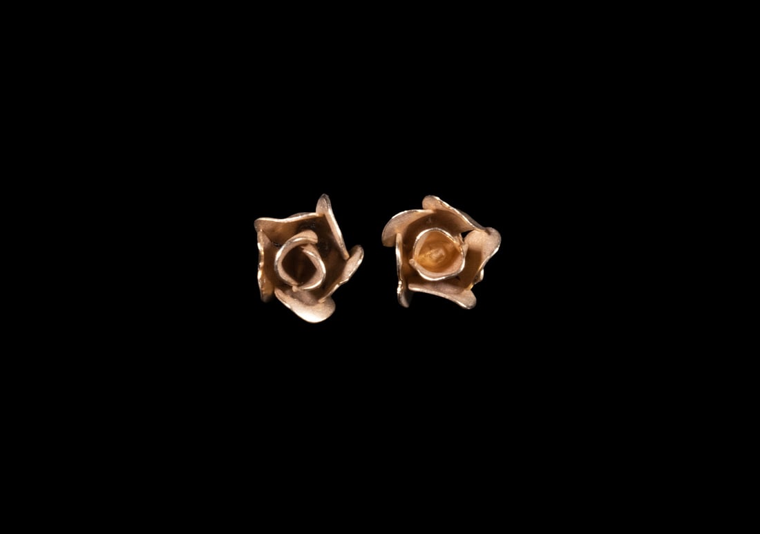 VINTAGE 14K GOLD ROSE FORM STUD EARRINGS, HSB MARK: VINTAGE 14K GOLD ROSE FORM STUD EARRINGS, HSB MARK A pair of 14K yellow gold stud earrings designed as stylized rose blossoms with layered petals and a soft satin finish. Marked ?14KT? and ?HSB,? by H