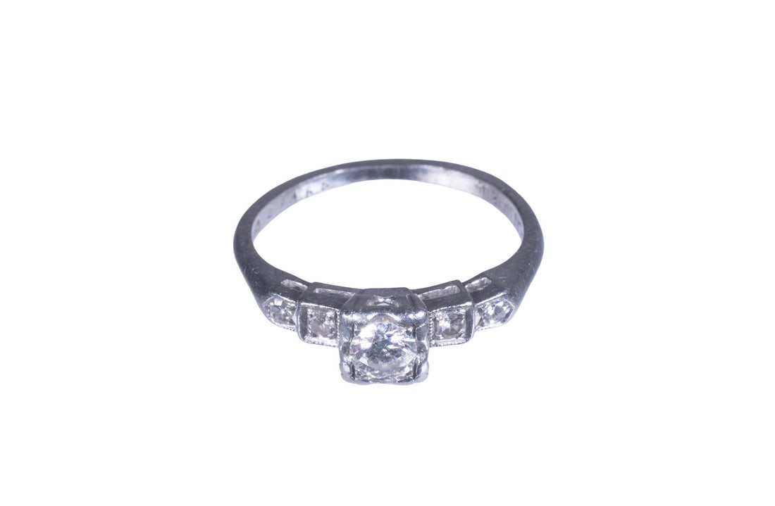 VINTAGE PLATINUM AND FIVE DIAMOND RING: VINTAGE PLATINUM AND FIVE DIAMOND RING A vintage platinum ring set with (5) graduated round diamonds, the center stone measuring approximately 3.79 mm, flanked by additional diamonds ranging from appr