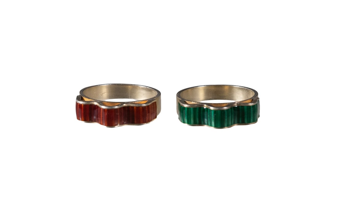 (2) ANTON MICHELSEN STERLING SILVER & ENAMEL RINGS: (2) ANTON MICHELSEN STERLING SILVER & ENAMEL RINGS (2) Mid-20th c. Danish Enameled and Gilded Sterling Silver Ribbon Design Rings, by the Anton Michelsen company (Copenhagen), one with red and the oth