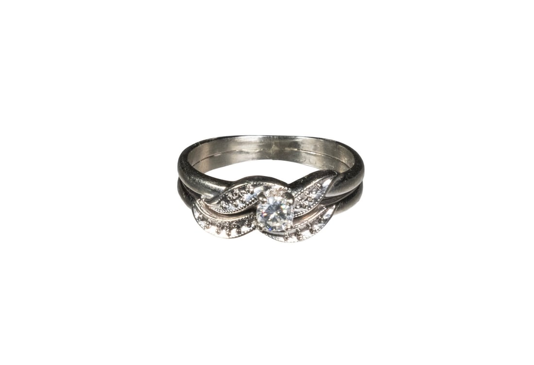 14K GOLD DIAMOND BRIDAL SET RING: 14K GOLD DIAMOND BRIDAL SET RING A 14K white gold bridal set ring, composed of an engagement ring and matching band soldered together, set with a round brilliant-cut diamond measuring approximately 3.