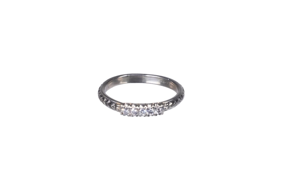 EDWARDIAN 18K WHITE GOLD DIAMOND ENGRAVED BAND RING: EDWARDIAN 18K WHITE GOLD DIAMOND ENGRAVED BAND RING An 18K white gold band ring set with (5) matching single-cut diamonds, each approx. 2.03 mm, in bead-style settings, display lively sparkle and good