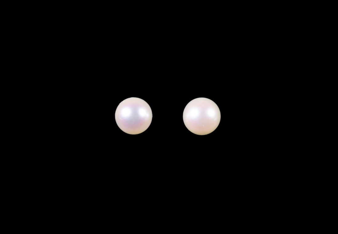 PR 14K GOLD PEARL STUD EARRINGS: PR 14K GOLD PEARL STUD EARRINGS A pair of cultured pearl stud earrings, each set with a round pearl measuring approximately 6.11 mm, displaying a soft white bodycolor. The pearls exhibit good luster w