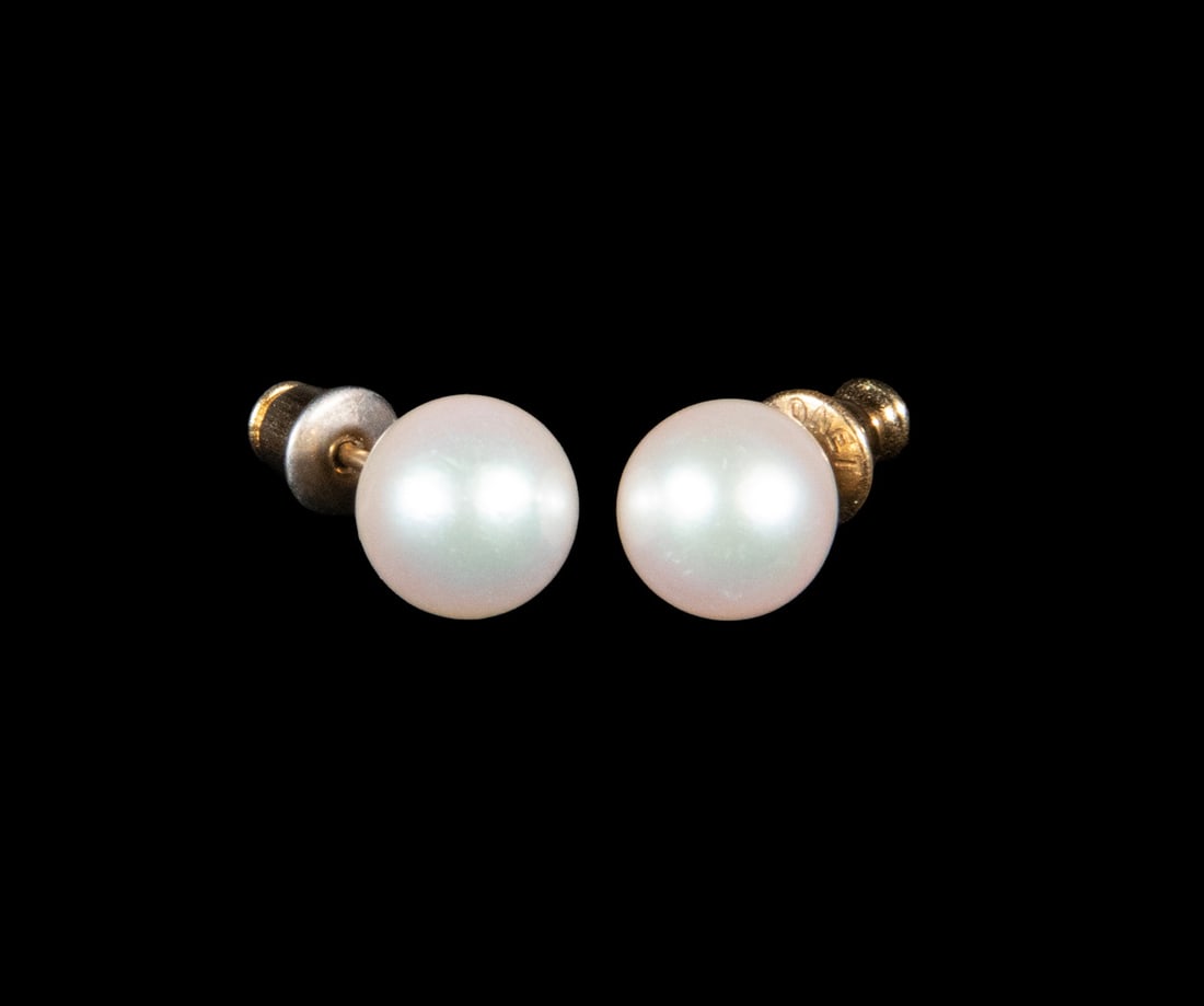 PR 14K GOLD PEARL STUD EARRINGS: PR 14K GOLD PEARL STUD EARRINGS A pair of cultured pearl stud earrings, each set with a near-round pearl measuring approximately 8.57 mm, displaying a soft white bodycolor with subtle overtones and