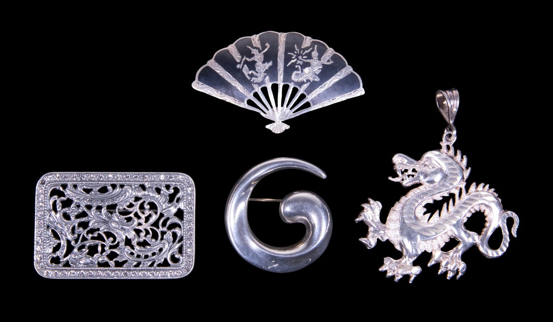(4) STERLING SILVER BROOCHES AND PENDANT: (4) STERLING SILVER BROOCHES AND PENDANT A group of four sterling silver jewelry pieces including three brooches and one pendant. Comprising an Asian-inspired fan-form brooch with engraved figural