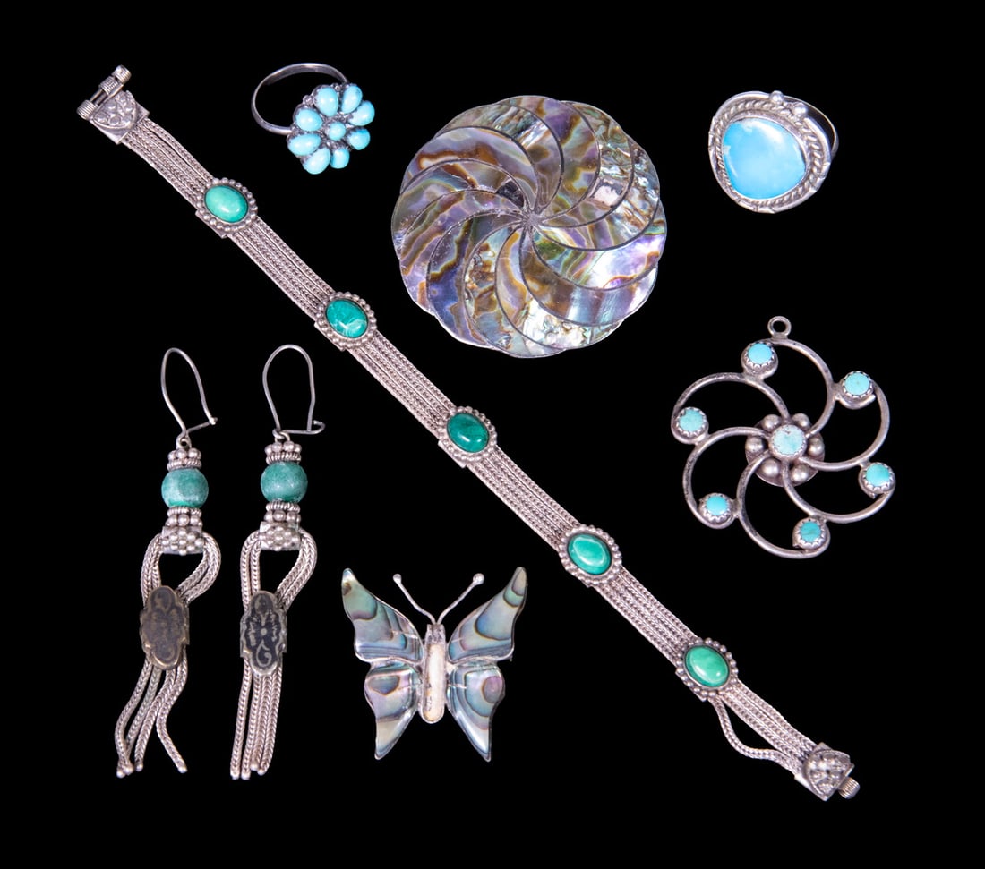 (7) STERLING SILVER AND INLAY JEWELRY: (7) STERLING SILVER AND INLAY JEWELRY A group of seven sterling silver jewelry items, including a bracelet set with green hardstone cabochons, a pair of drop earrings with bead accents, two rings set 