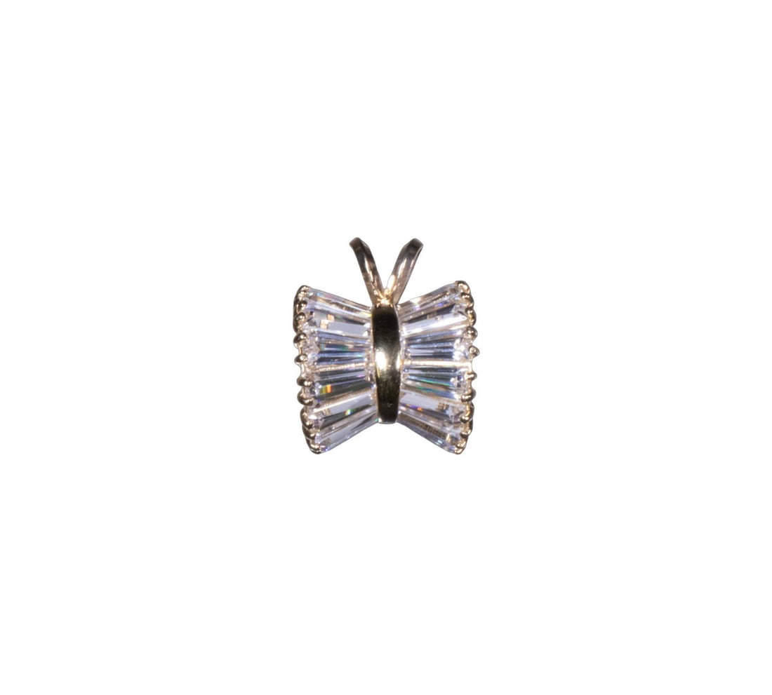 14K GOLD AND CUBIC ZIRCONIA BOW PENDANT: 14K GOLD AND CUBIC ZIRCONIA BOW PENDANT A 14k yellow gold pendant in the form of a stylized bow, set with numerous tapered baguette-cut cubic zirconia, channel-set, forming a shimmering ribbon effect 