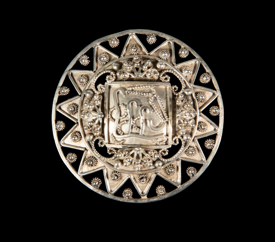 ITALIAN FRANCONERI .800SILVER FILIGREE BROOCH: ITALIAN FRANCONERI .800SILVER FILIGREE BROOCH Round Italian 800 silver brooch by Franconeri, featuring a pierced sunburst border centering an applied monogram within an elaborate filigree and granulat